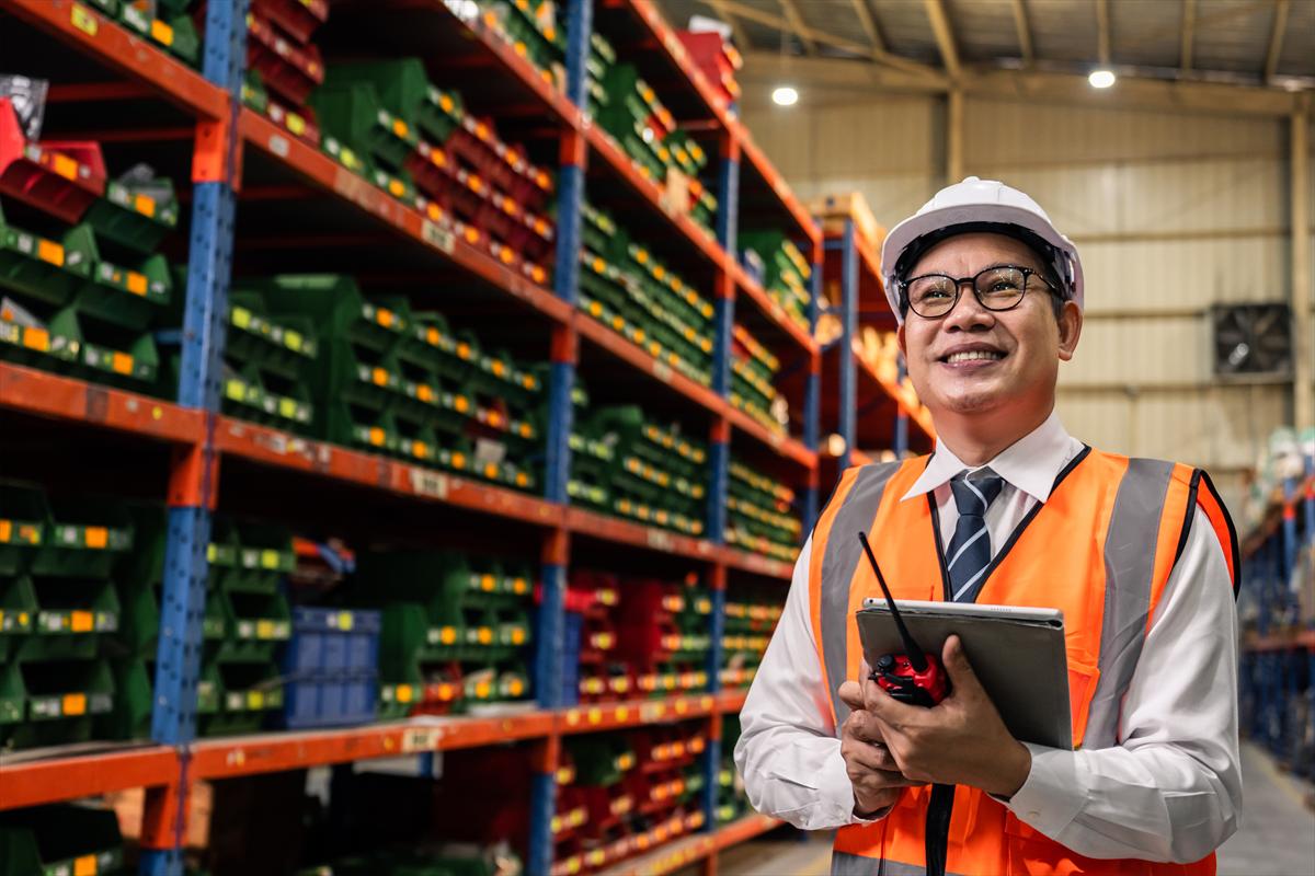 Industrial worker reviewing job costs